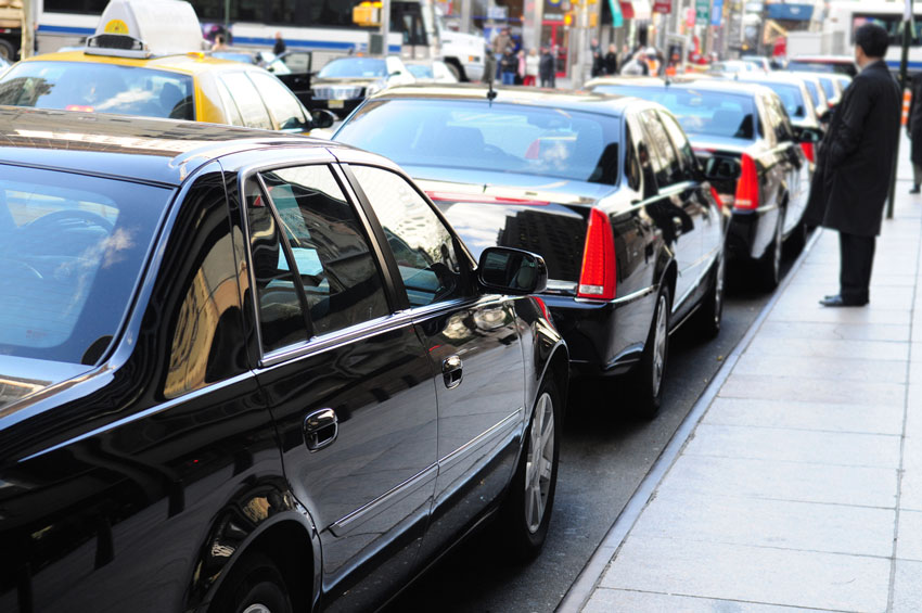 Several limousines parked on a street